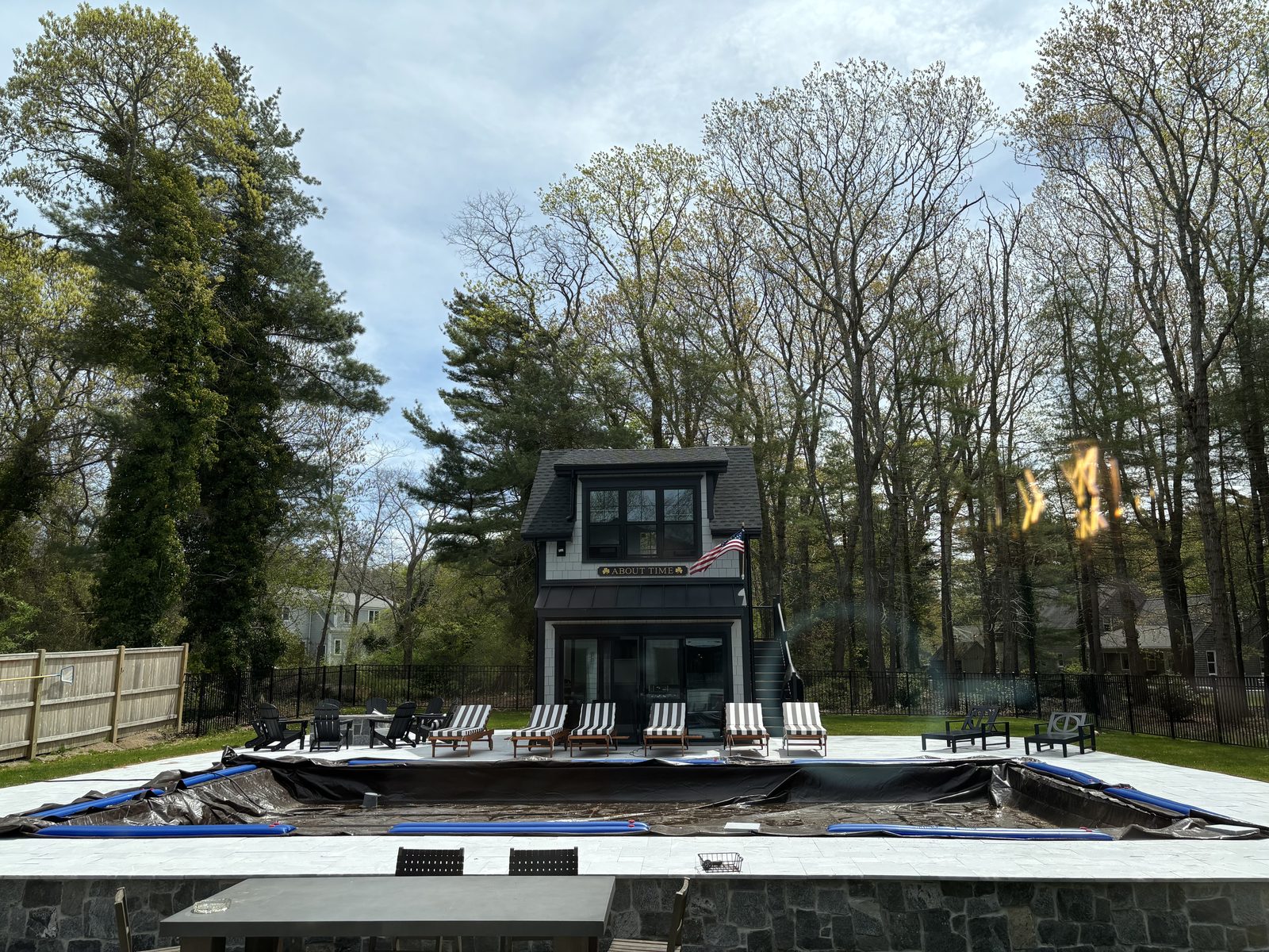 Completed pool house and patio in spring